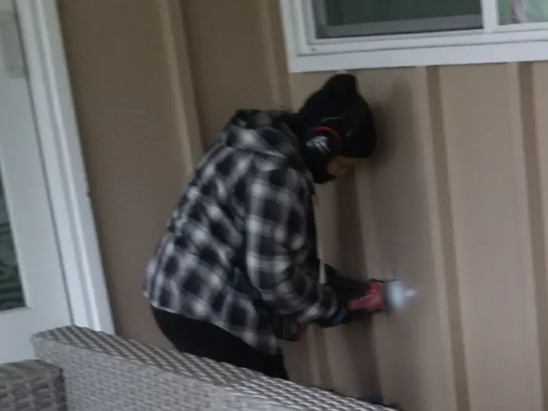 Professional electrician installing an exterior outlet in Codorus
